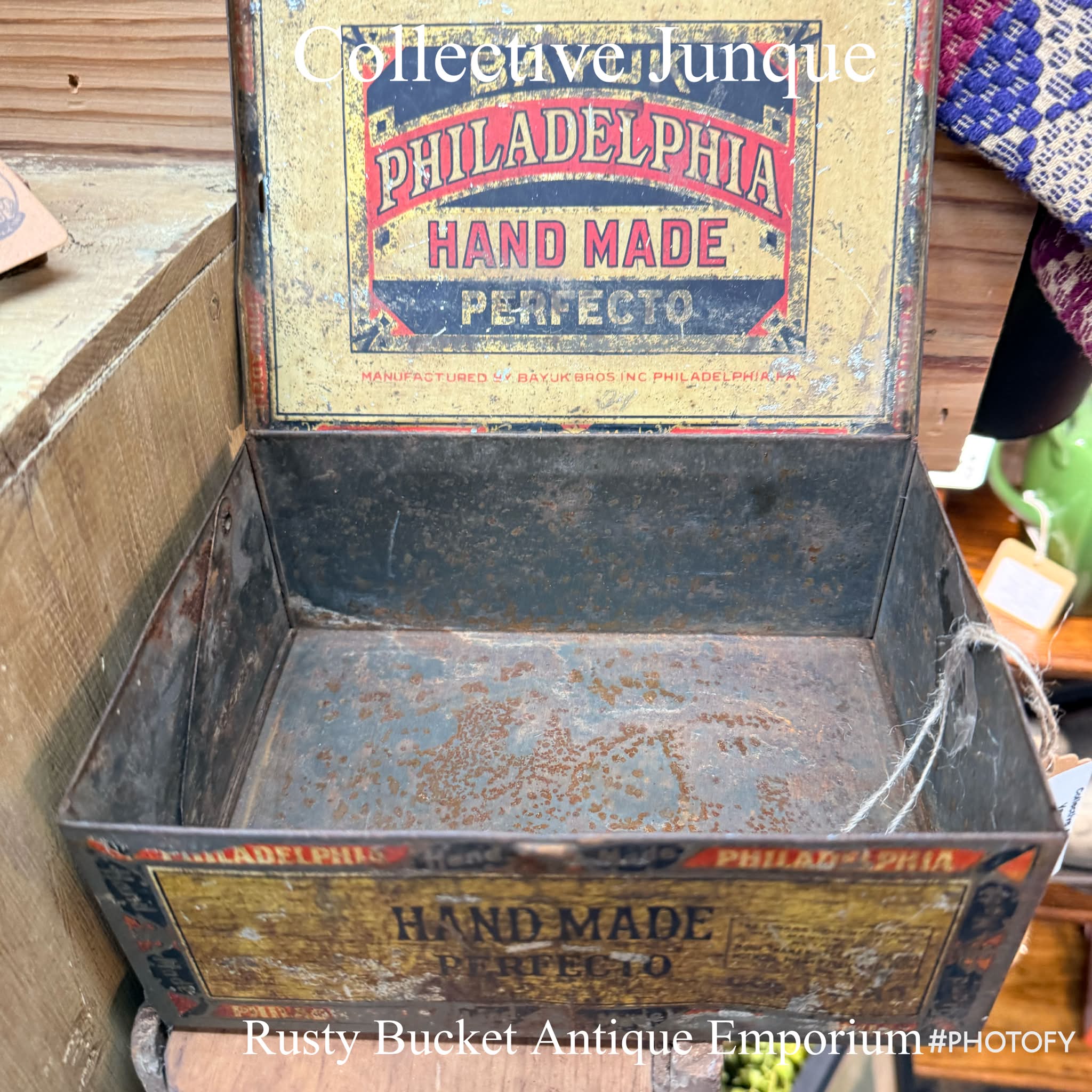 Vintage wooden cigar box is brown with a hinged lid and metal