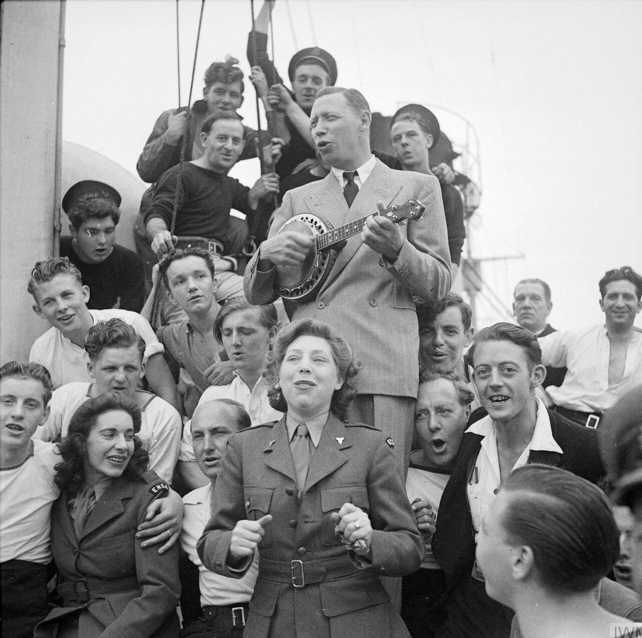 World - George Formby and his wife Beryl Ingham entertain the crew of ...