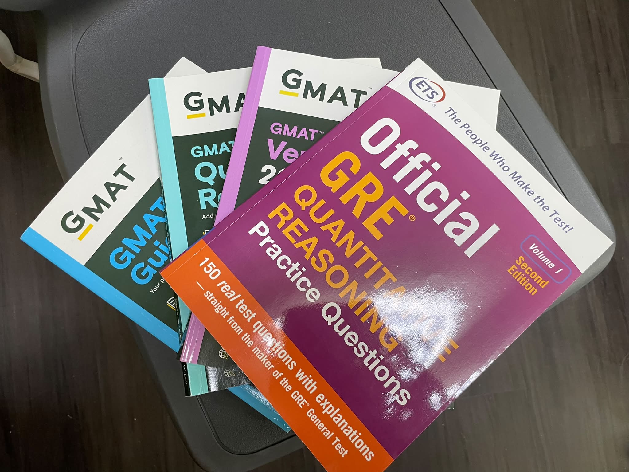 GMAT and GRE preparation books. Price: $25