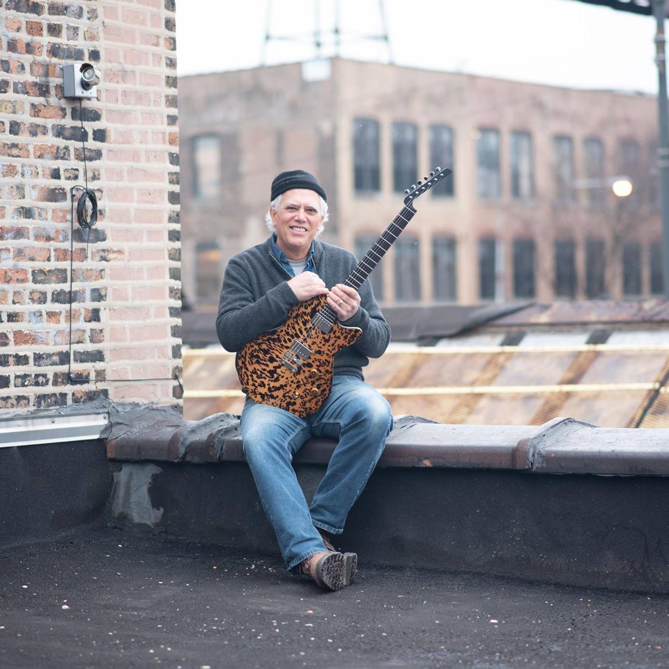 To understand this opening in the back of the guitar, you can watch the ...