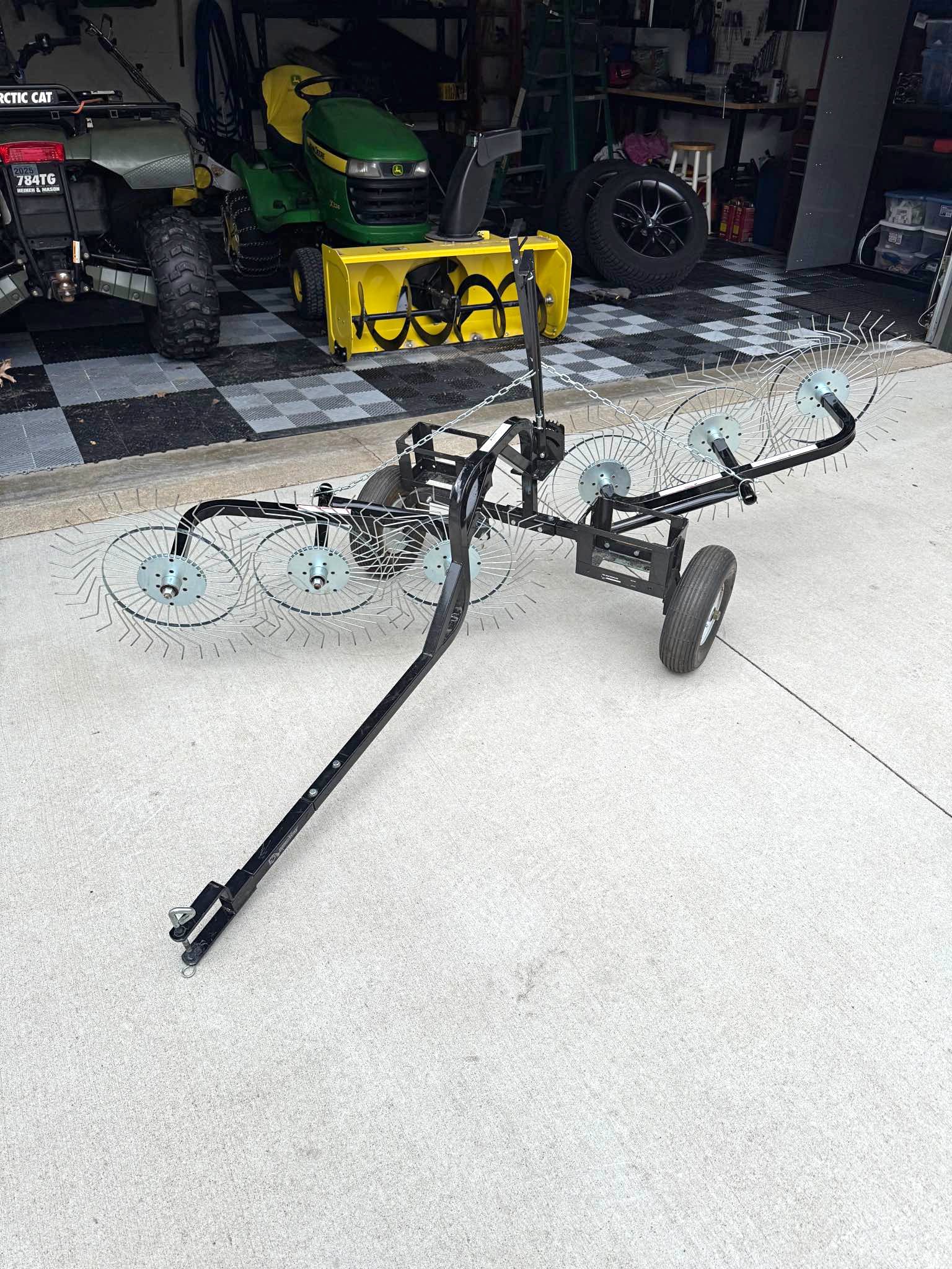 Pull-behind wheel rake for dethatching lawns without hurting grass ...