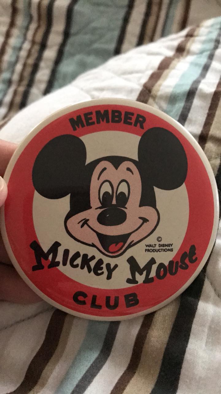 Why does this vintage Mickey have a button on his side?