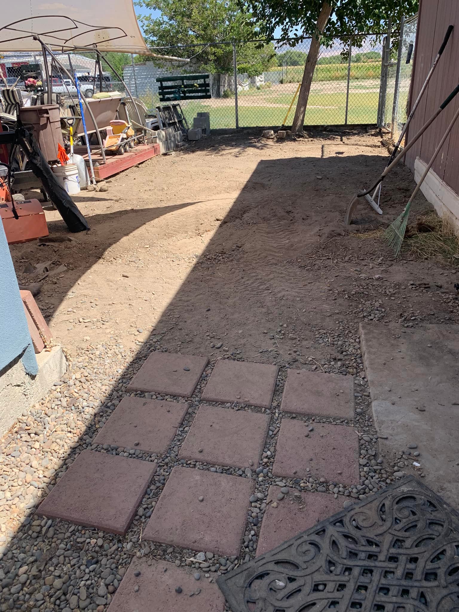 New patio with... - E_Lizard seamless gutters and landscaping