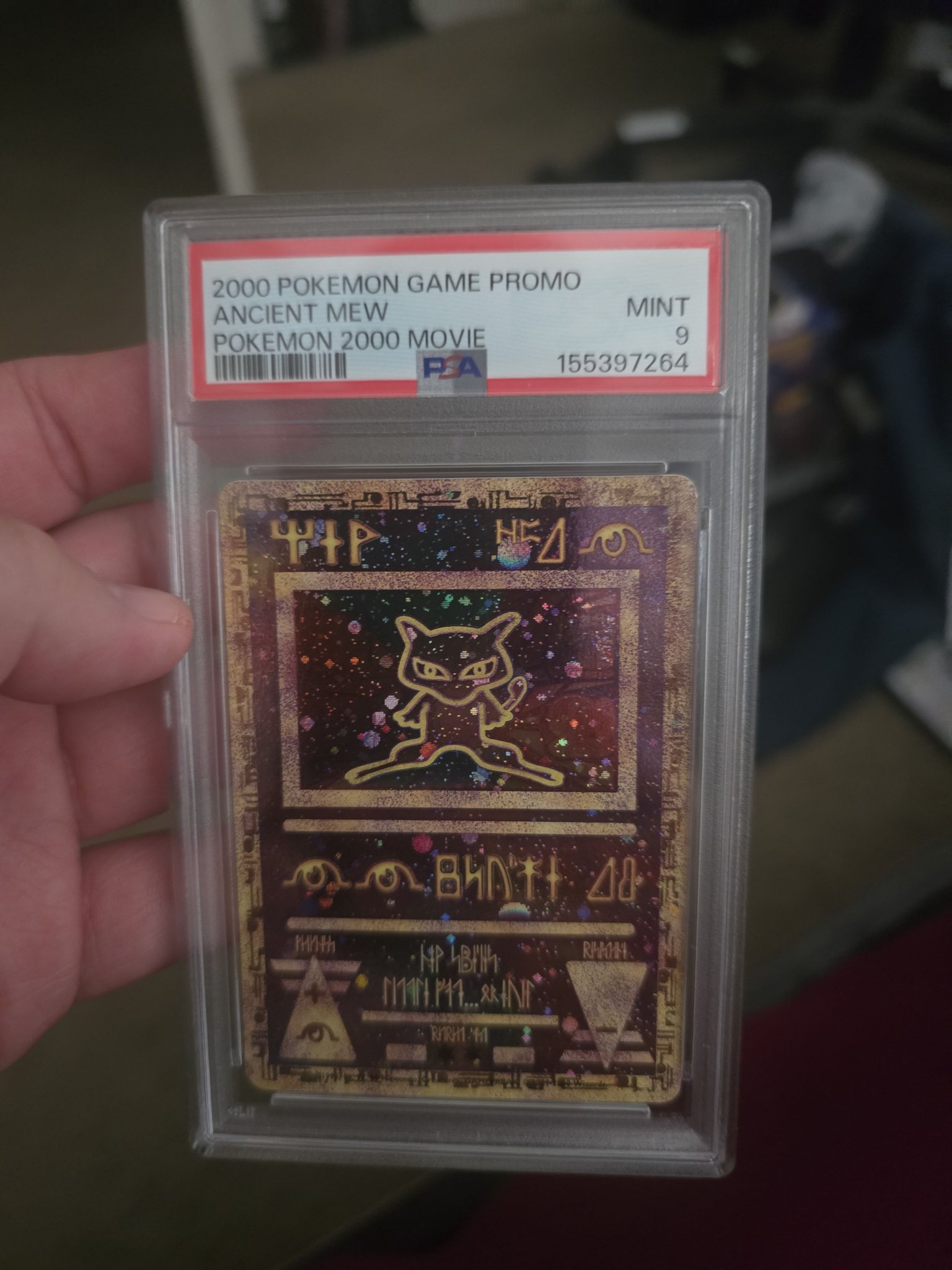 PSA 9 graded 2000 Pokémon Game Promo Ancient Mew card for preservation