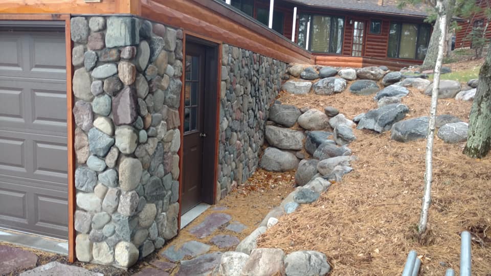 New boat house rock walls - Pro Care Landscaping corp.