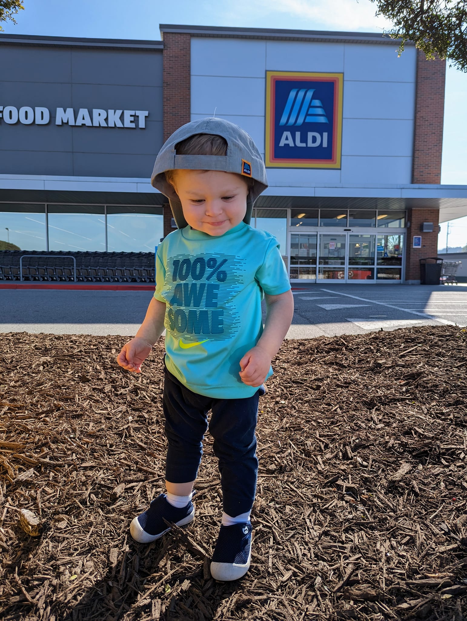 We scored some Aldi merch today! My son loves the smiley face cap 😆