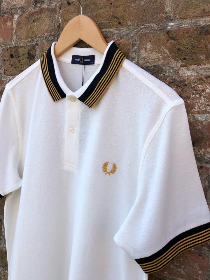 The Laurel Wreath is our difference. There isn't another polo