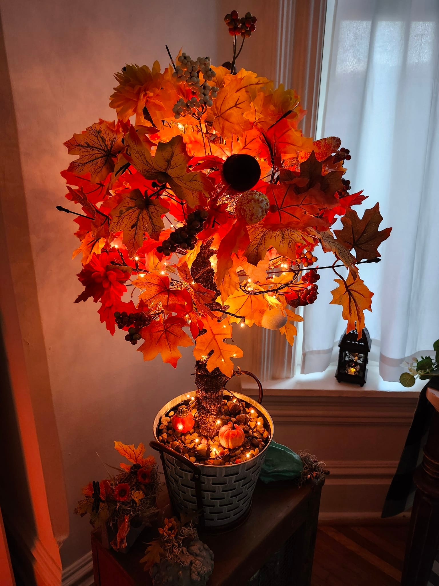 DIY autumn tree made from toilet plunger and Dollar Tree leaves