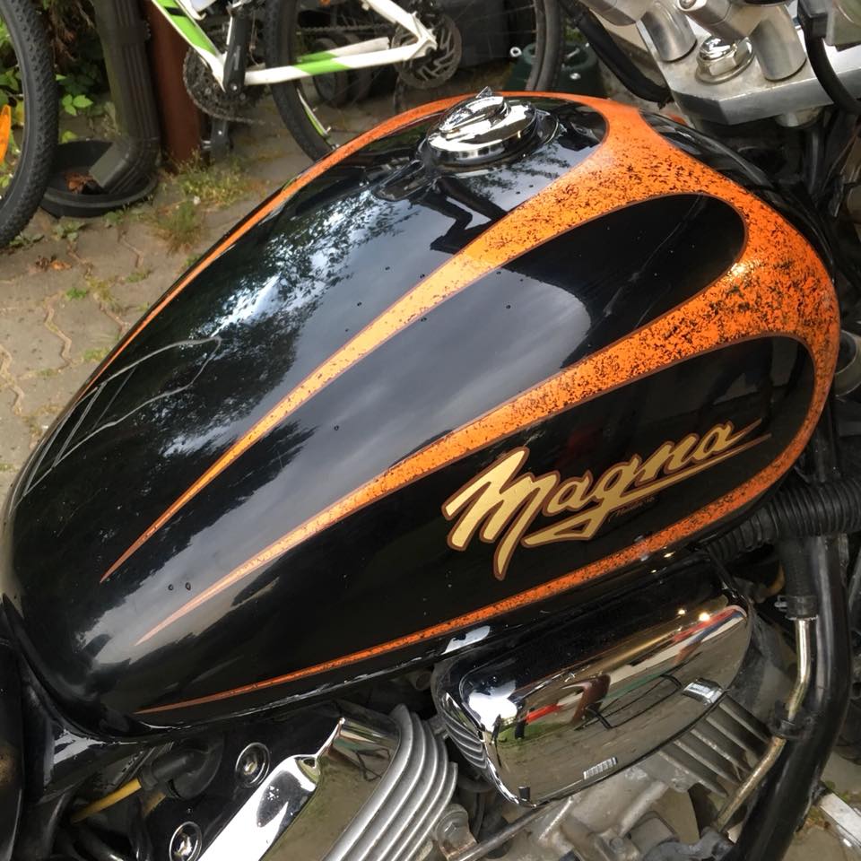 This Honda Magna's tank had deep scratches from falling, so I