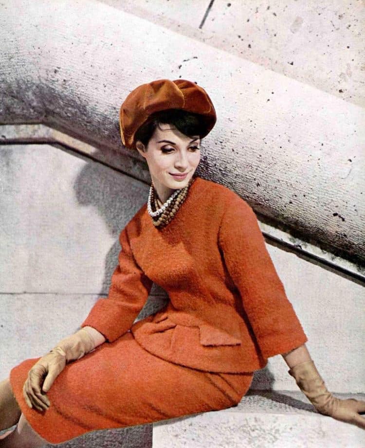 Model in orange bouclé two-piece by Pierre Cardin, photo by Joseph