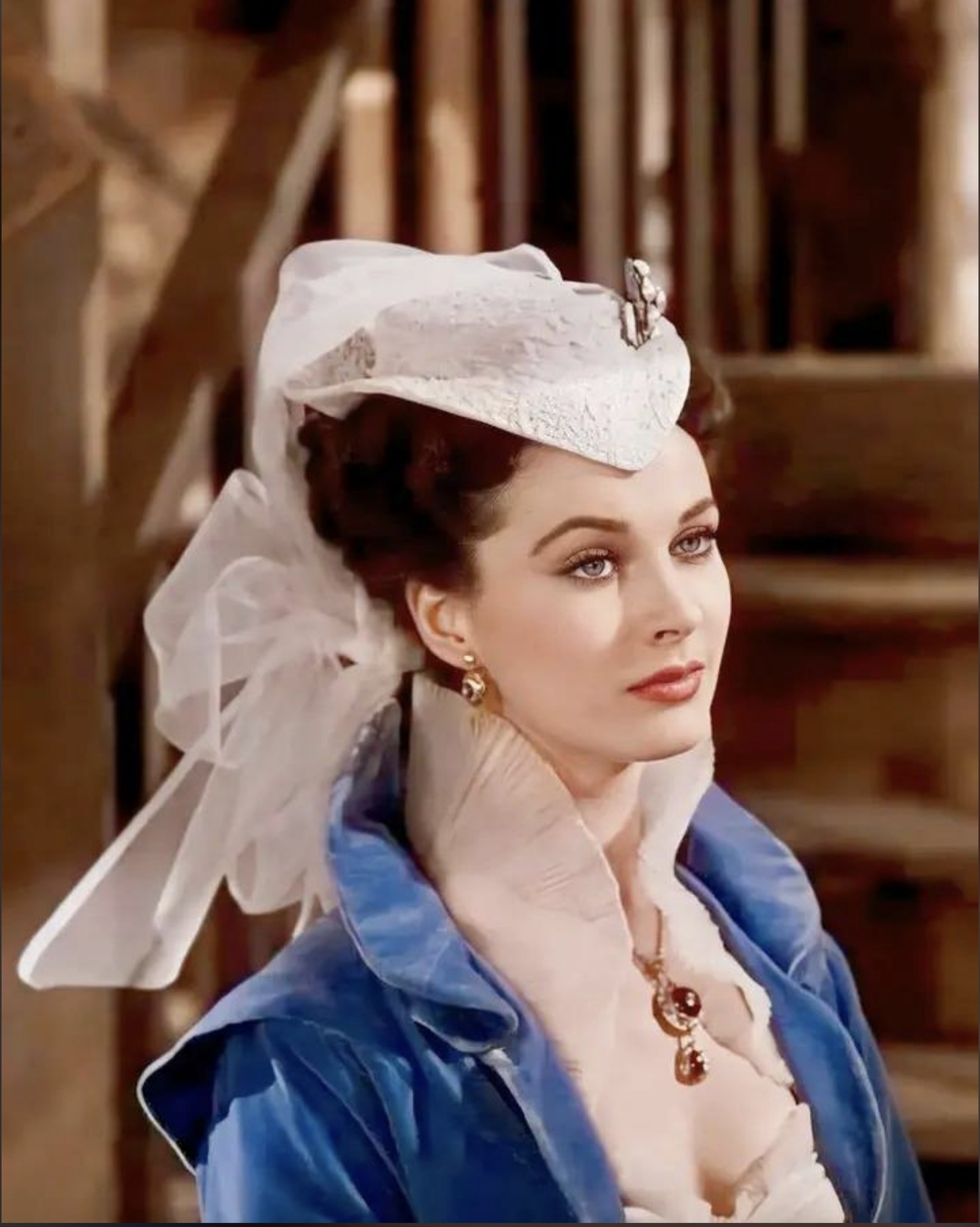 Vivien Leigh as Scarlet O'Hara, wearing a day dress with blue velvet bolero jacket in 