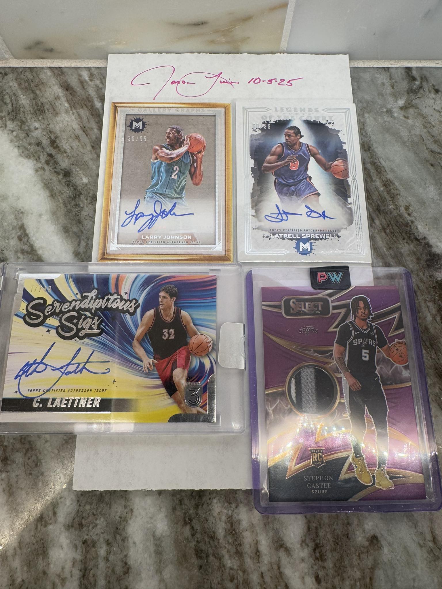 NBA player autograph cards including Kevin Love and Magic Johnson