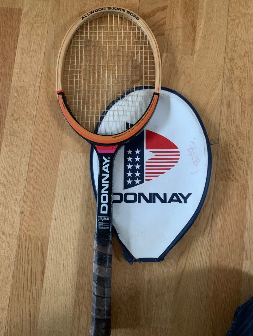 The tennis racket is a Donnay Björn Borg model, a classic wooden