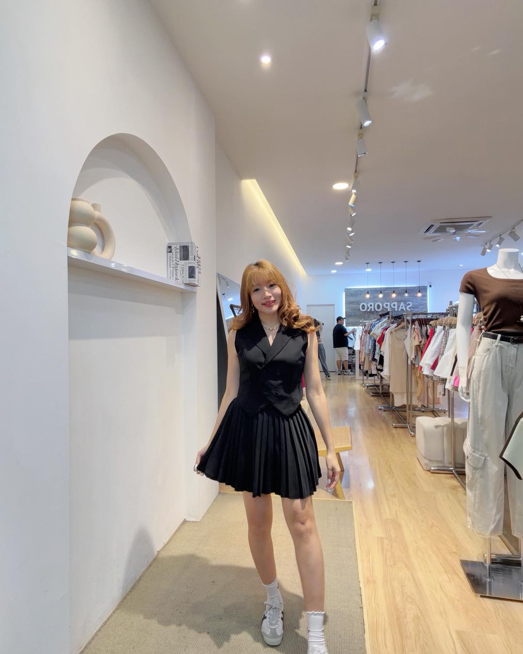Tailored vest and pleated skort set in black