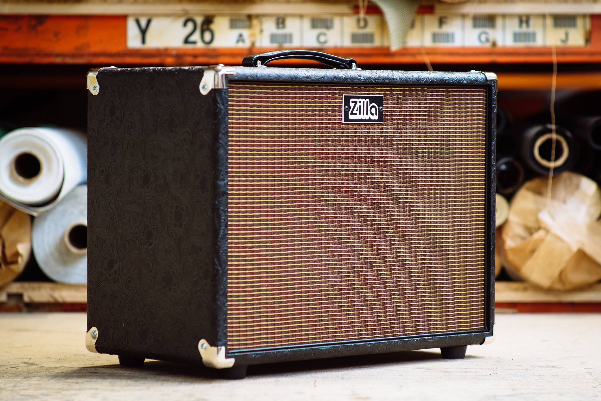 Ported 1x12 in black western tolex with oxblood grill.