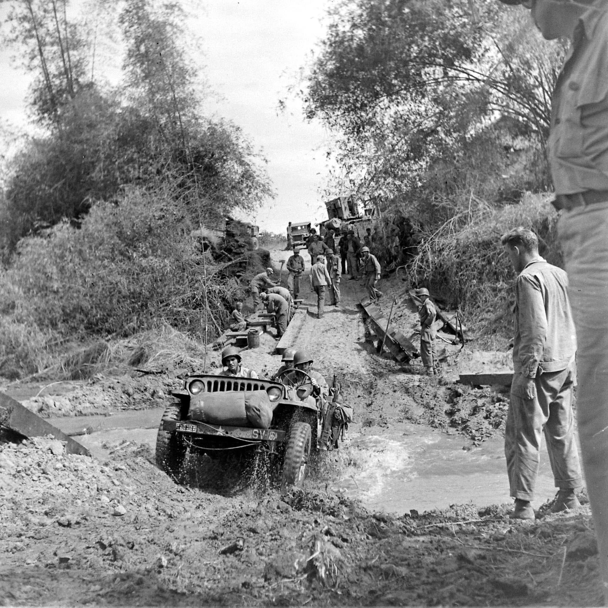 World - US Jeeps cross a muddy ravine in Luzon, Philippines - Early ...