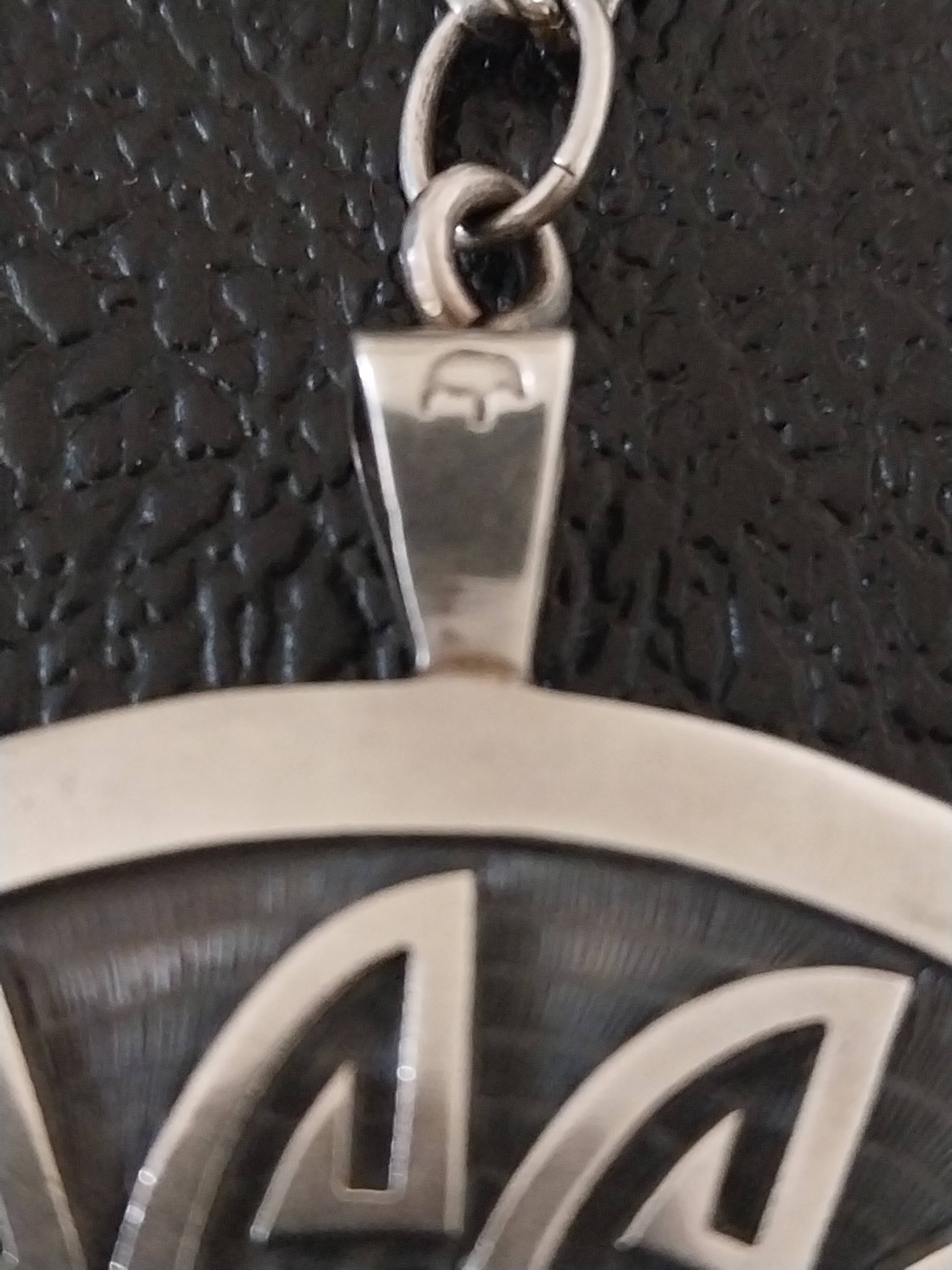 Hopi overlay pendant by Lawrence Saufkie