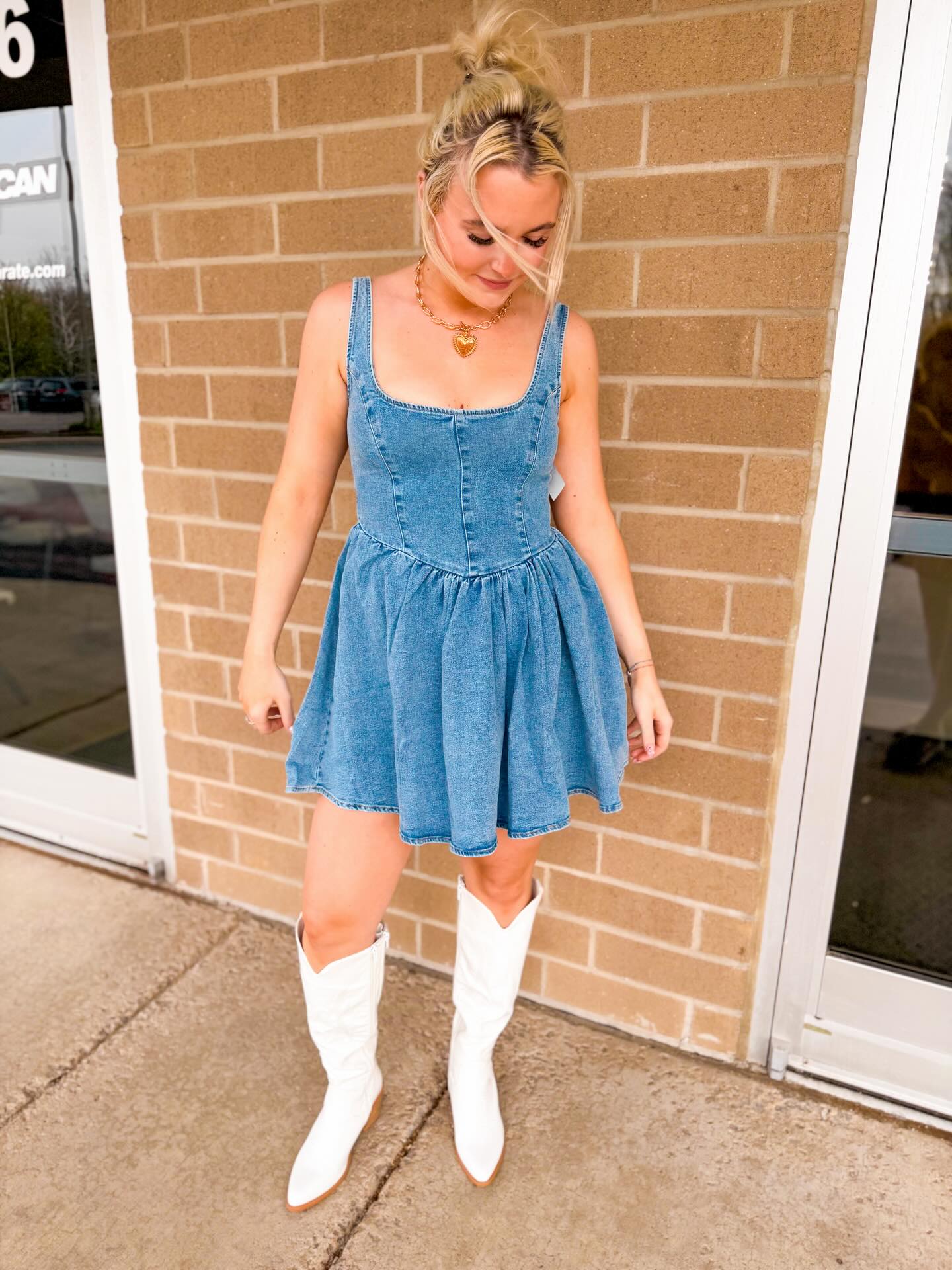 💙THIS JUST IN💙 Check out our latest wholesale arrival! This cute denim dress, paired with our white cowgirl boots is the perfect find for concert season🤠✨ And that bow detail is SO