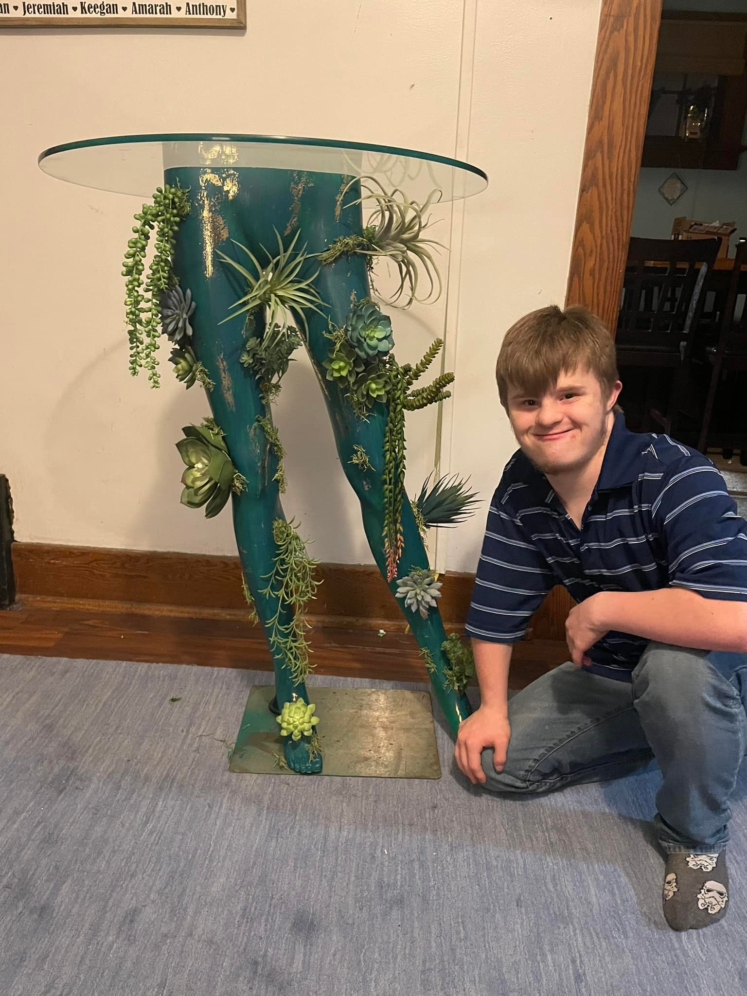 Upcycled mannequin decor with succulents and moss