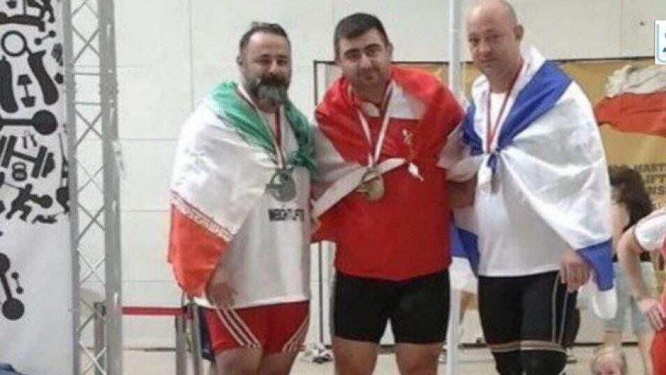 Ilan Klinger - Iranian weightlifter Mustafa Rajai(on the...