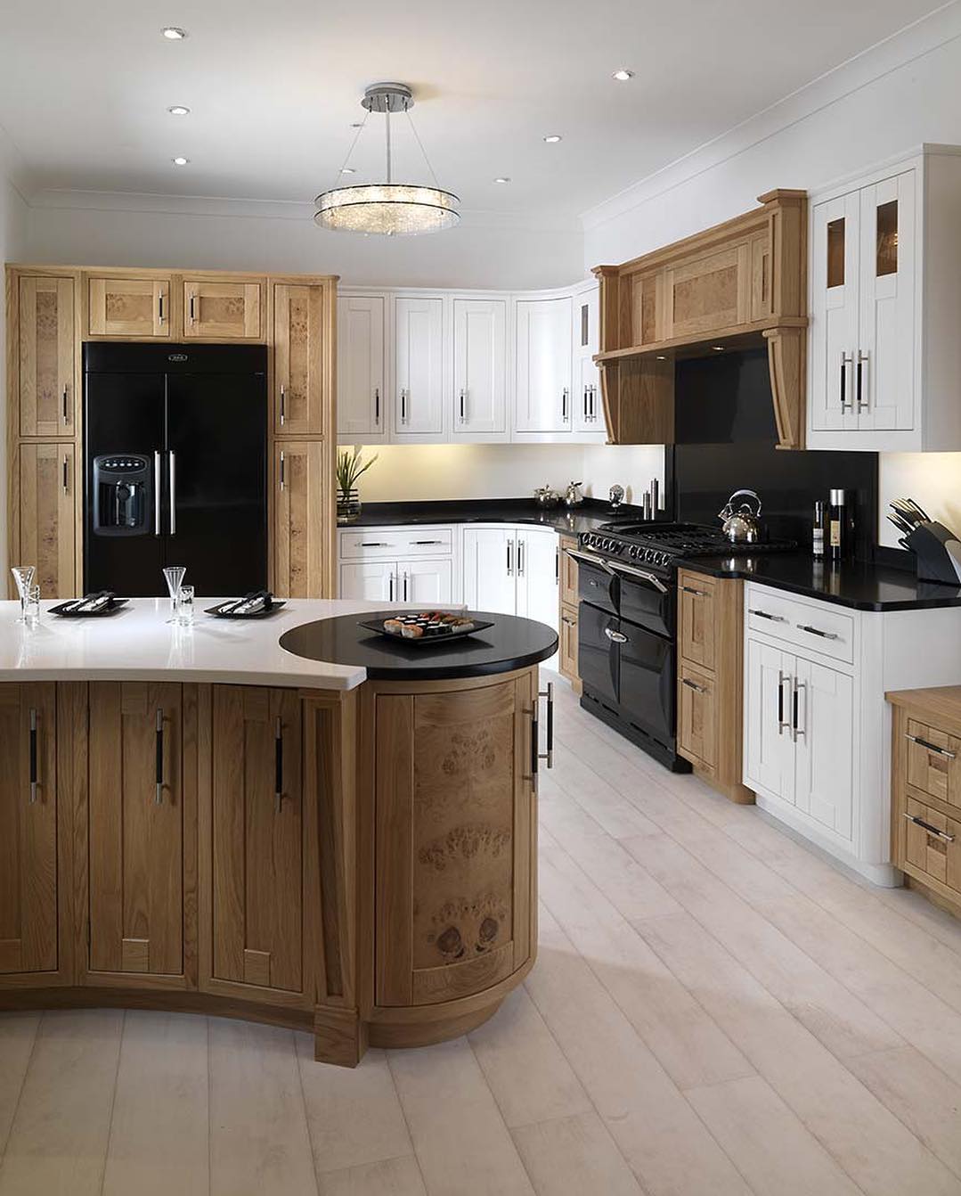 Osborne Interiors - This beautiful designer kitchen mixes the modern ...