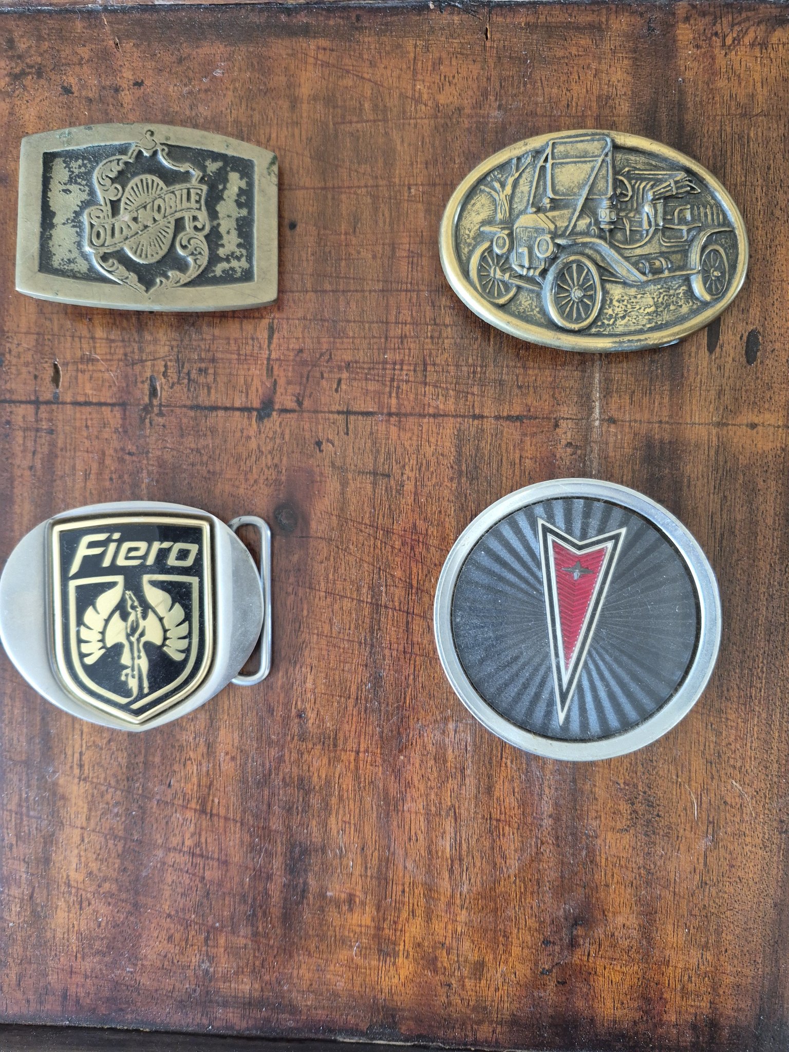 Vintage Pontiac belt buckles and emblem collection
