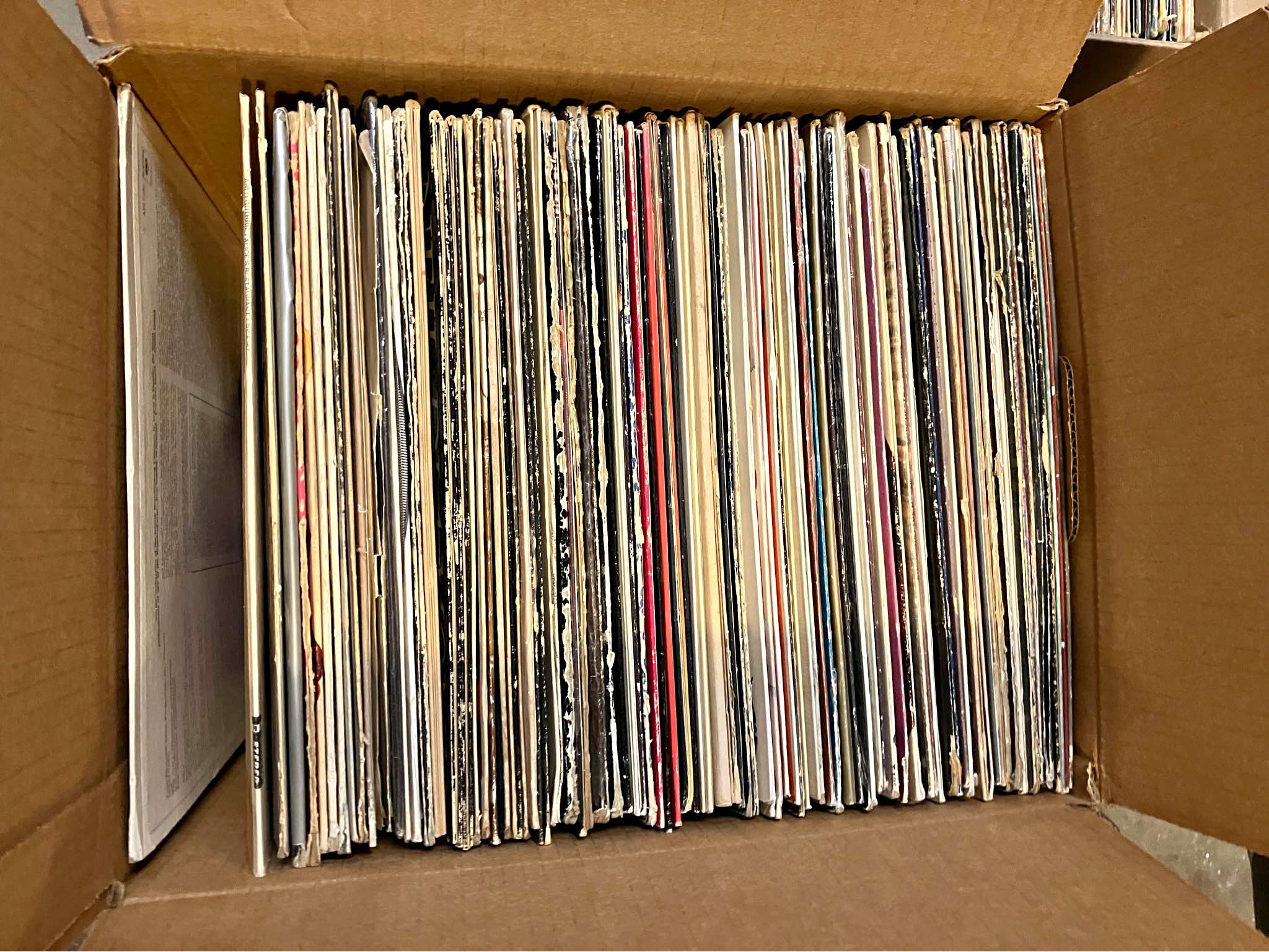 Approx 110 vinyl records and a large stack of 45 rpm 7