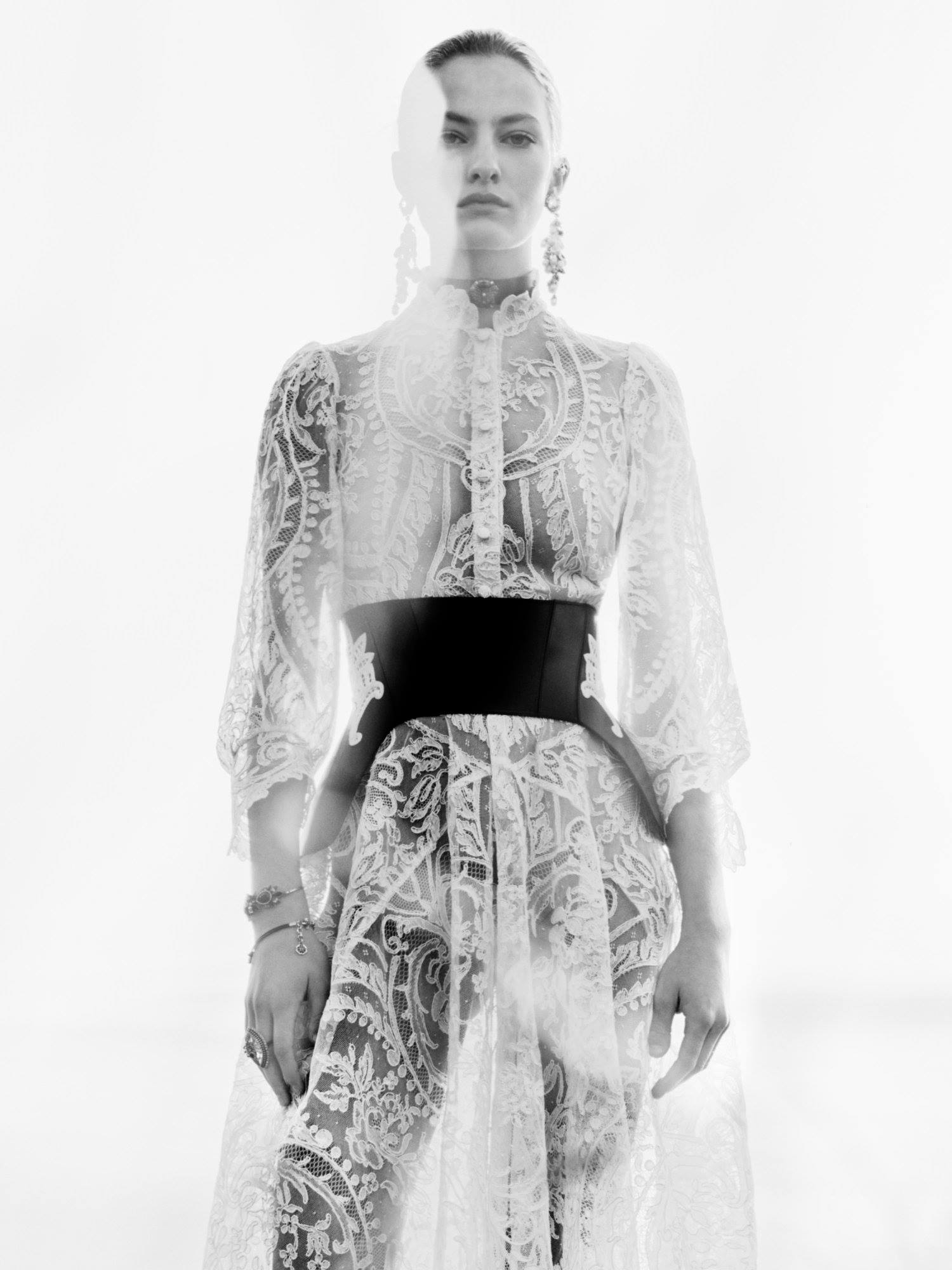broderie corset dress in ivory An cotton lace with scalloped edges worn with a anglaise embroidered belt. From the Alexander McQueen Spring/Summer 2019 pre-collection. Explore: bit.ly/PRESS19MCQUEEN Gown