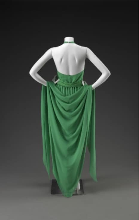 halston green dress Among the most recognizable dresses ever designed by Halston, this gorgeous from the mid-70s is covered in rows of clear sequins applied in a special proprietary technique. Over a silky cream-colored evening 70's halston dresses