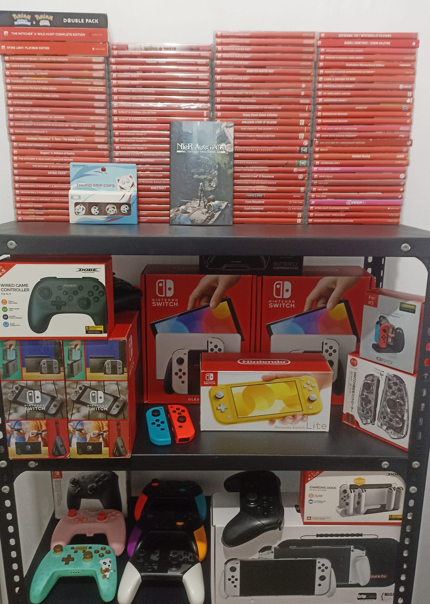 PlayStation 4, Nintendo Switch OLED, and an extra set of joy cons