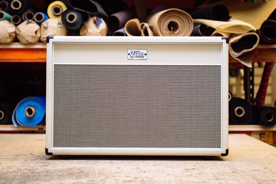 Modern 2x12 in red bronco tolex with black grill and white piping