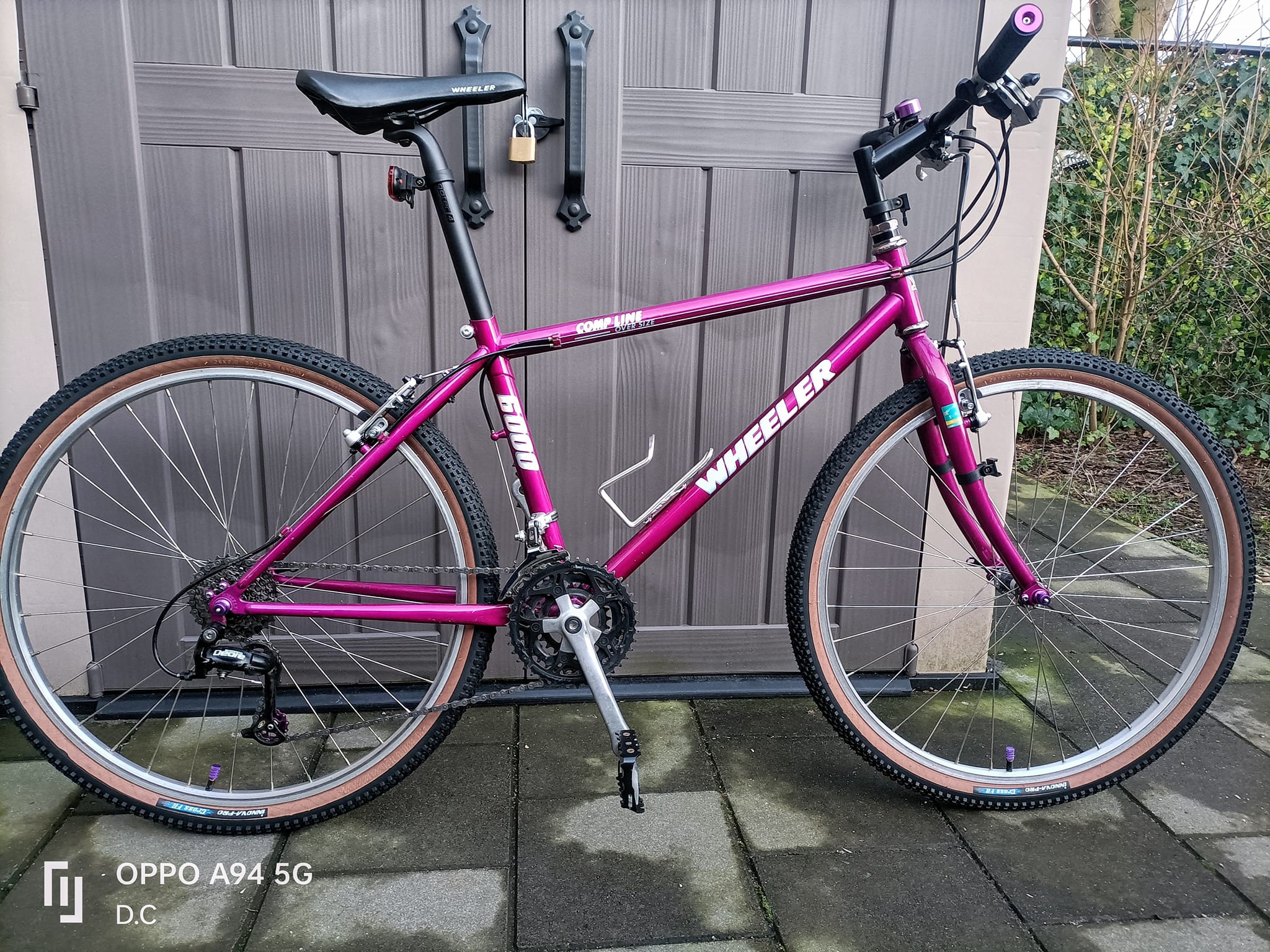 1990 cafe cruiser bicycle with teal and purple color scheme