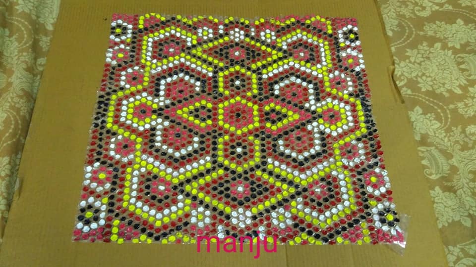 Made a Rangoli on a small piece... - Art and Craft from Manju