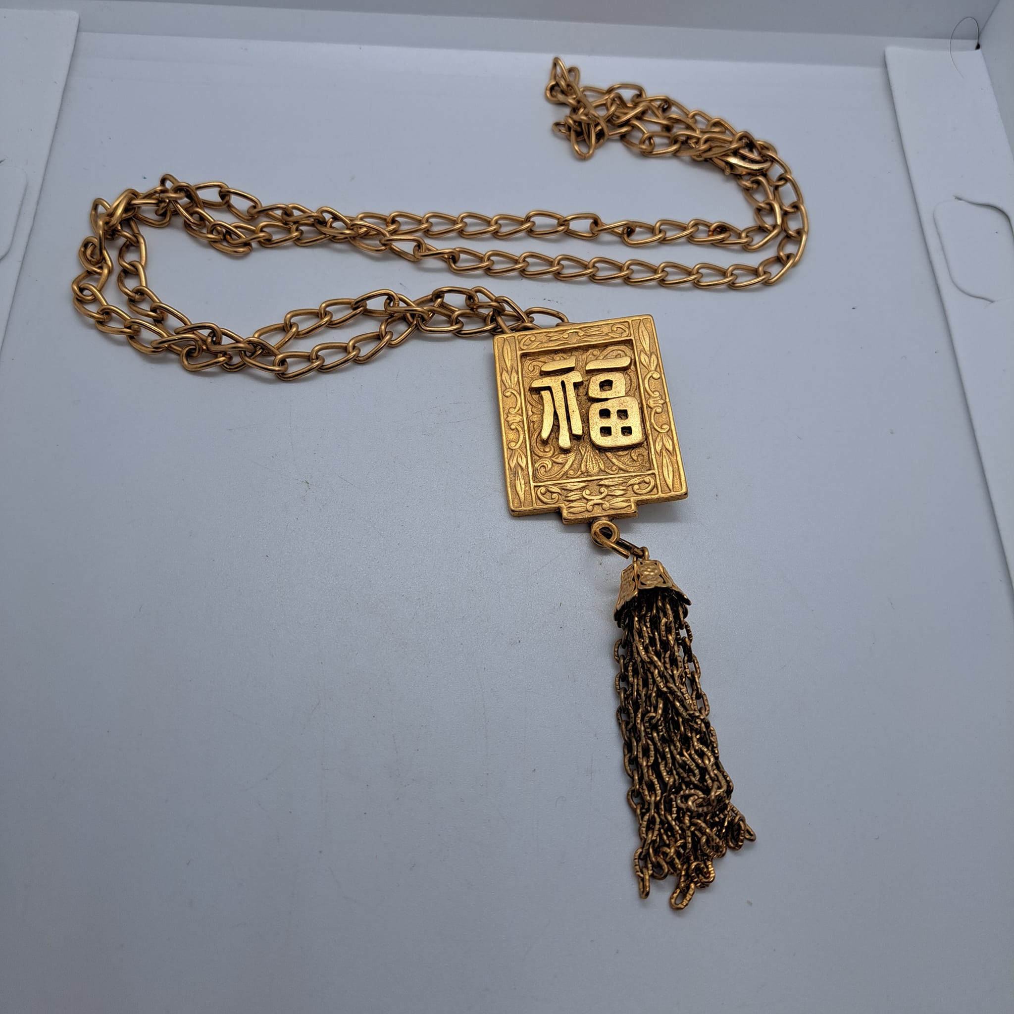 What is the meaning of Japanese or Chinese markings on jewelry?