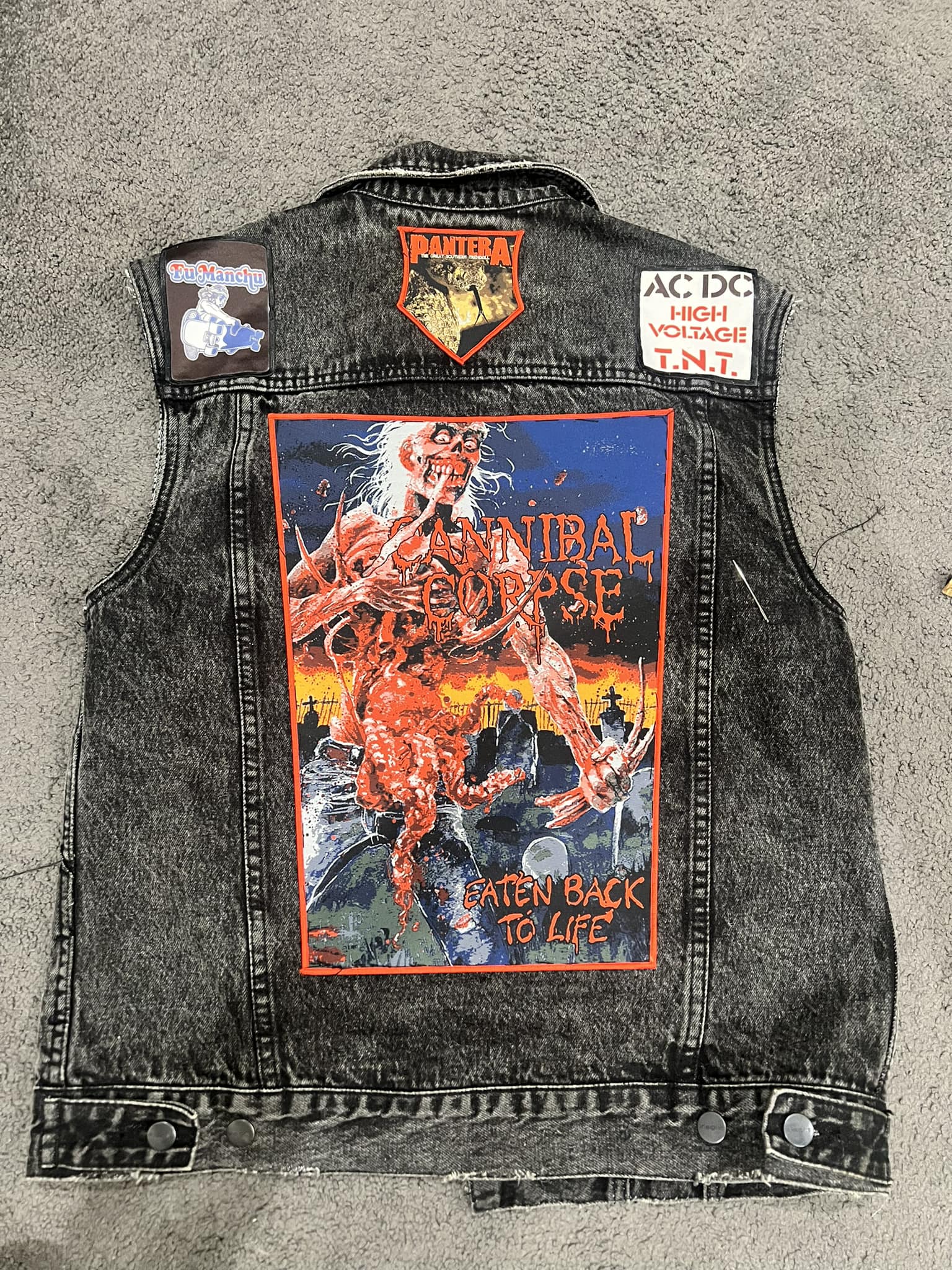 Battle vest with concert patches from bands seen since 2024