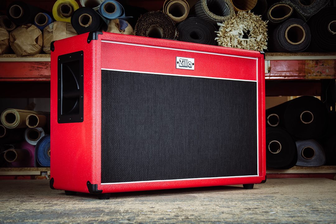 Modern 2x12 in red bronco tolex with black grill and white piping