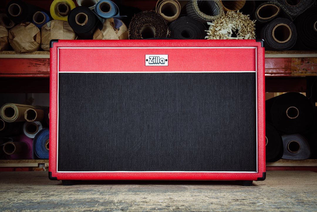 Modern 2x12 in red bronco tolex with black grill and white piping