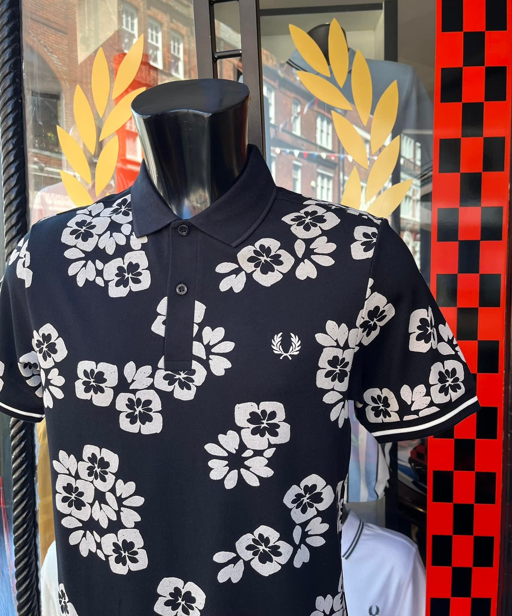 The Laurel Wreath is our difference. There isn't another polo