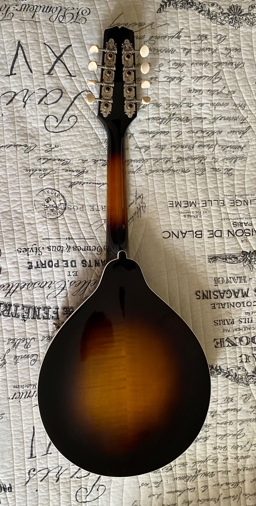 Is the Kentucky KM700 mandolin solid wood?