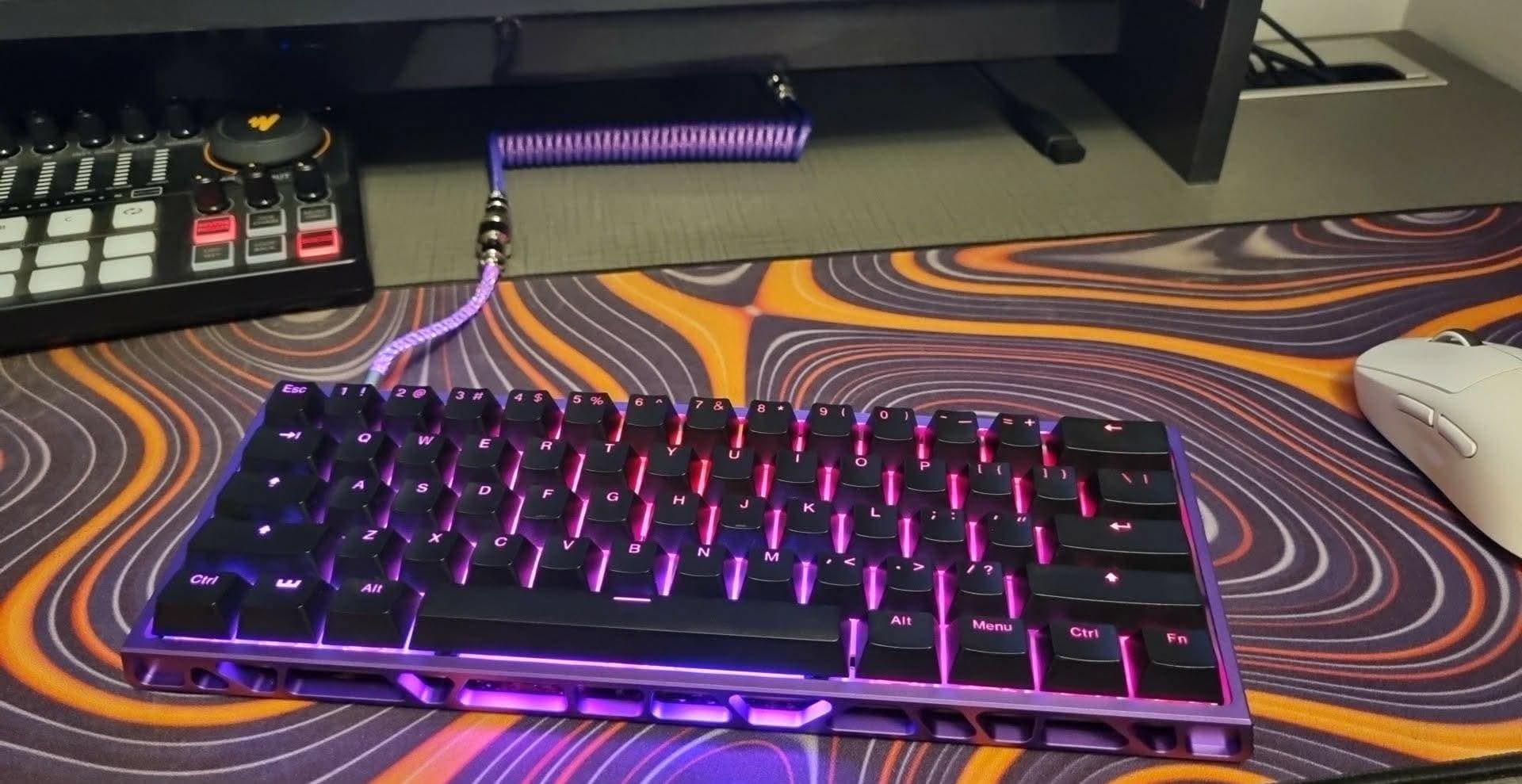 Custom Wooting 60HE keyboard with purple aluminum case and RGB 