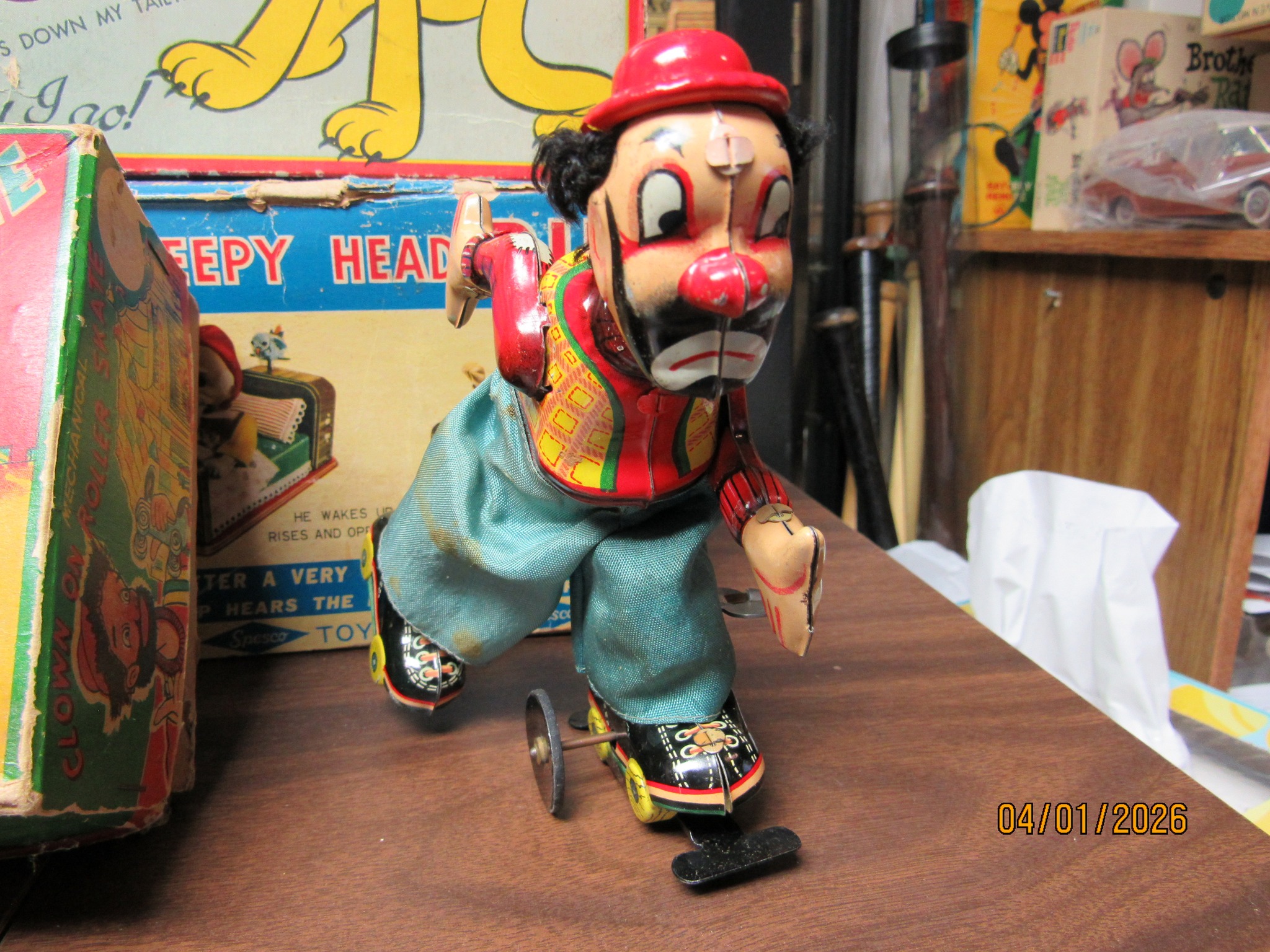 Vintage clown on roller skate toy