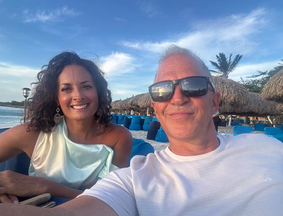 How do people typically dress for dinner at Passions on the beach?