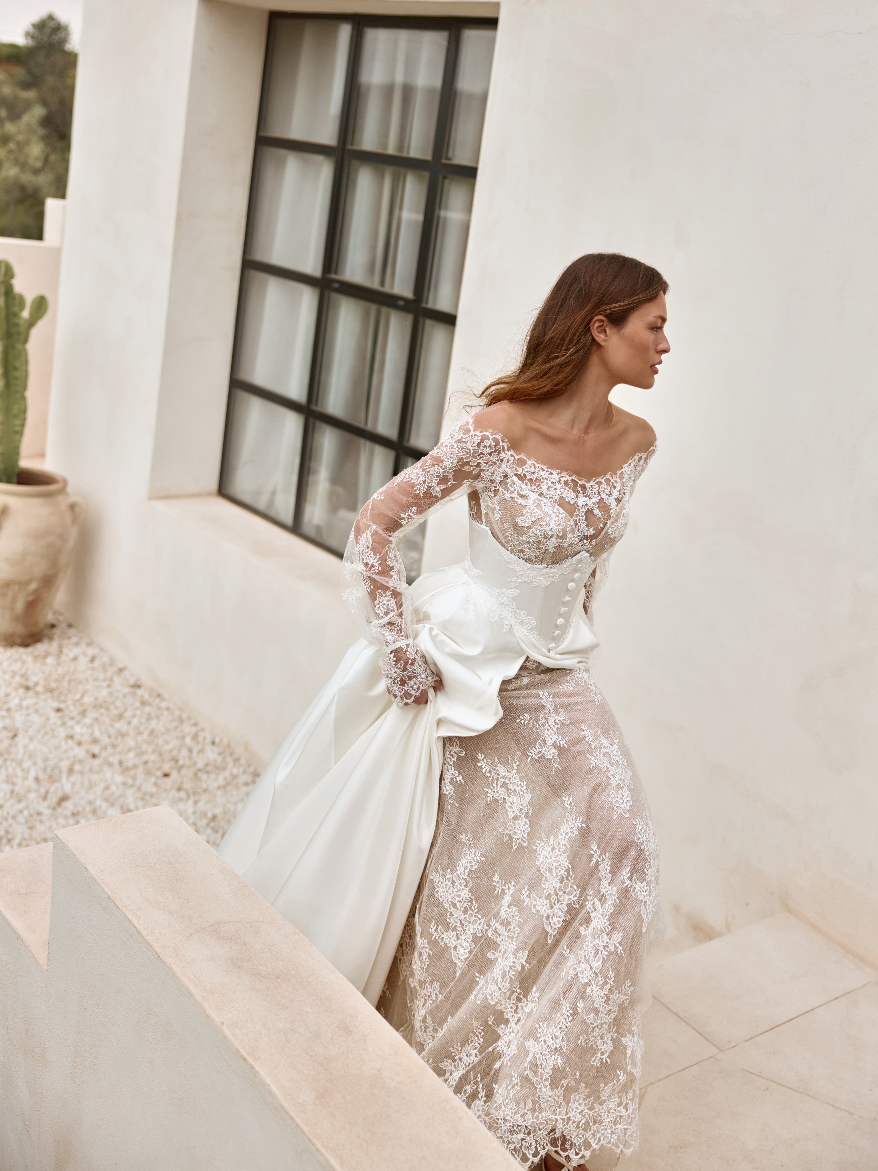 One gown, endless elegance. Crafted from delicate French Chantilly lace, this design can be styled with detachable dramatic satin overskirt, creating two unforgettable bridal looks for your most special day #ARIVILLOSO