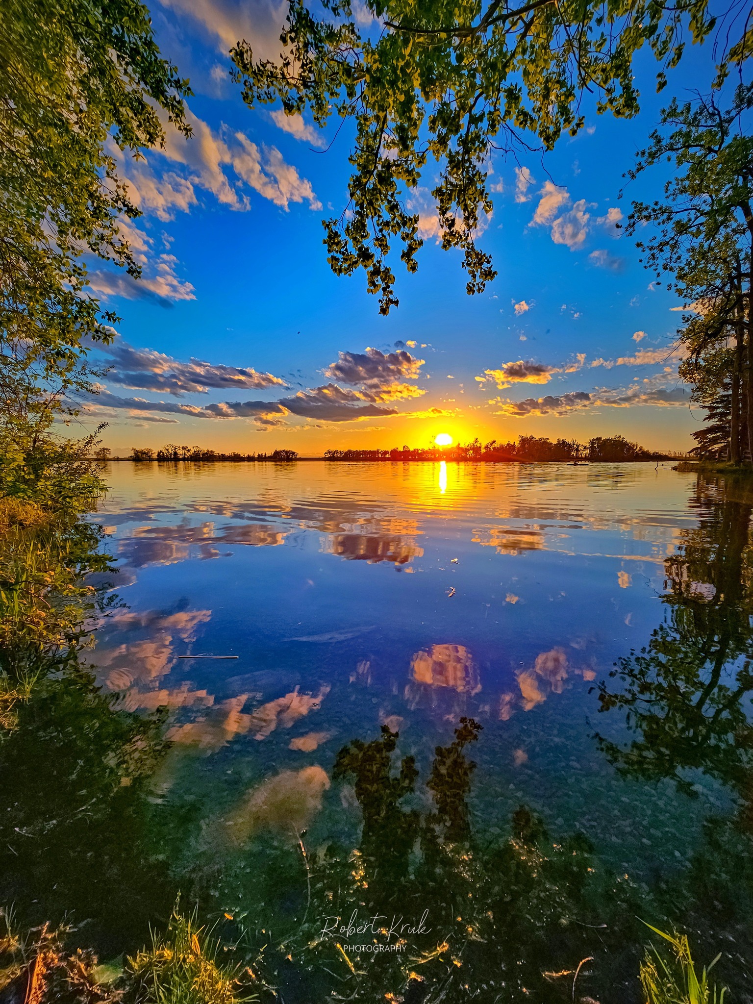 A quiet glass of wine by the water, golden hour settling in - The