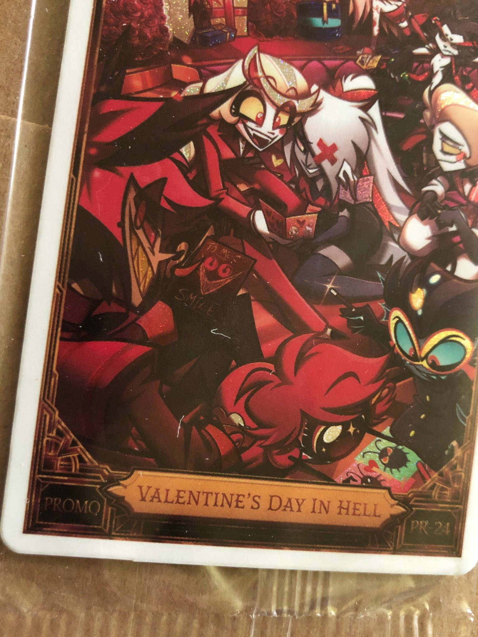 Hazbin Hotel Valentine's Day trading cards with scratches