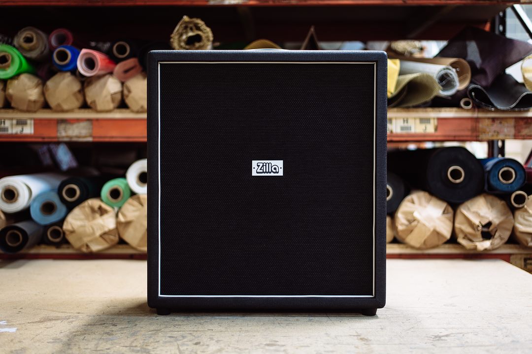 Modern 2x12 in red bronco tolex with black grill and white piping