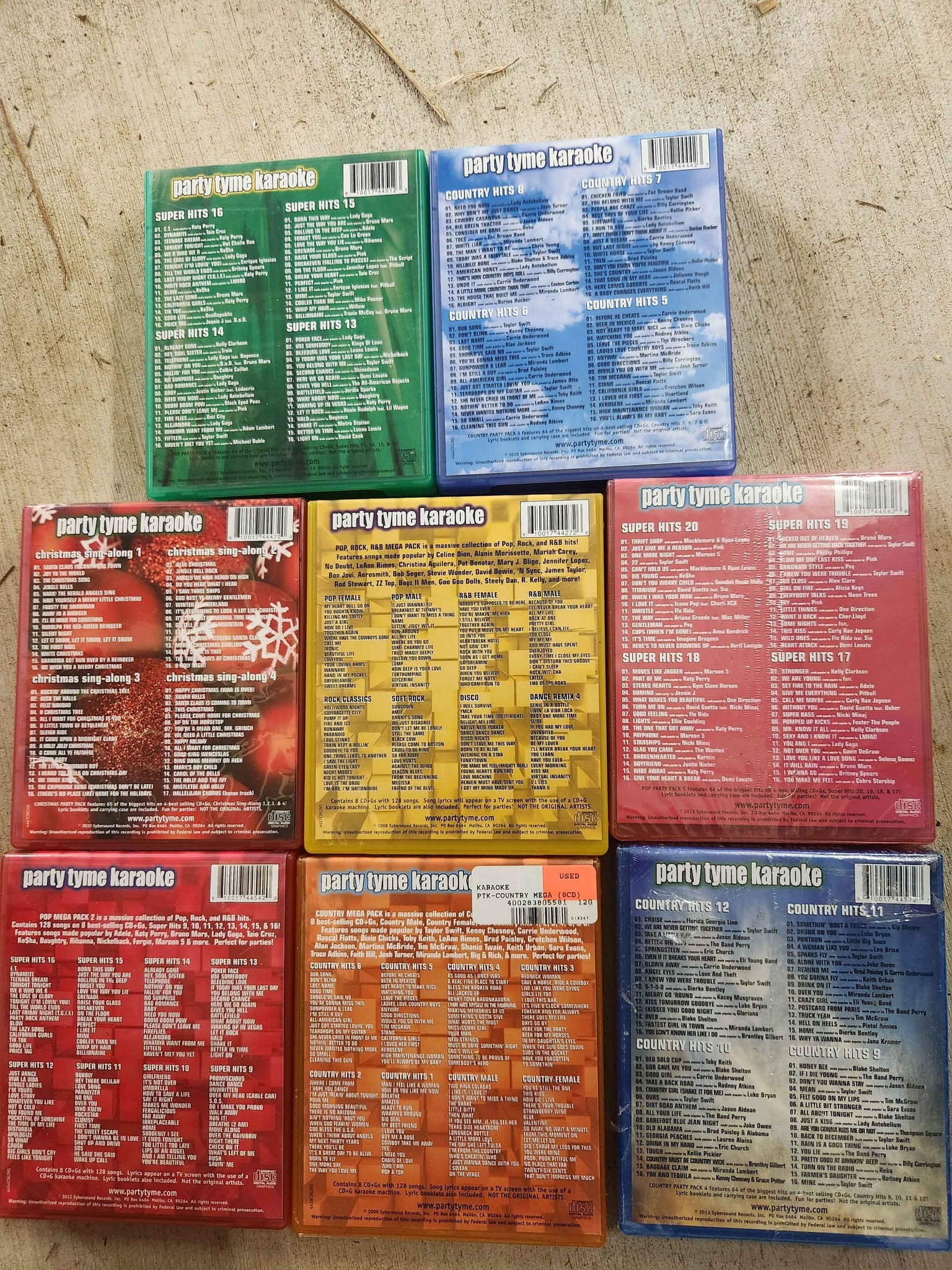 Diverse collection of Party Tyme Karaoke CD+G discs. This lot