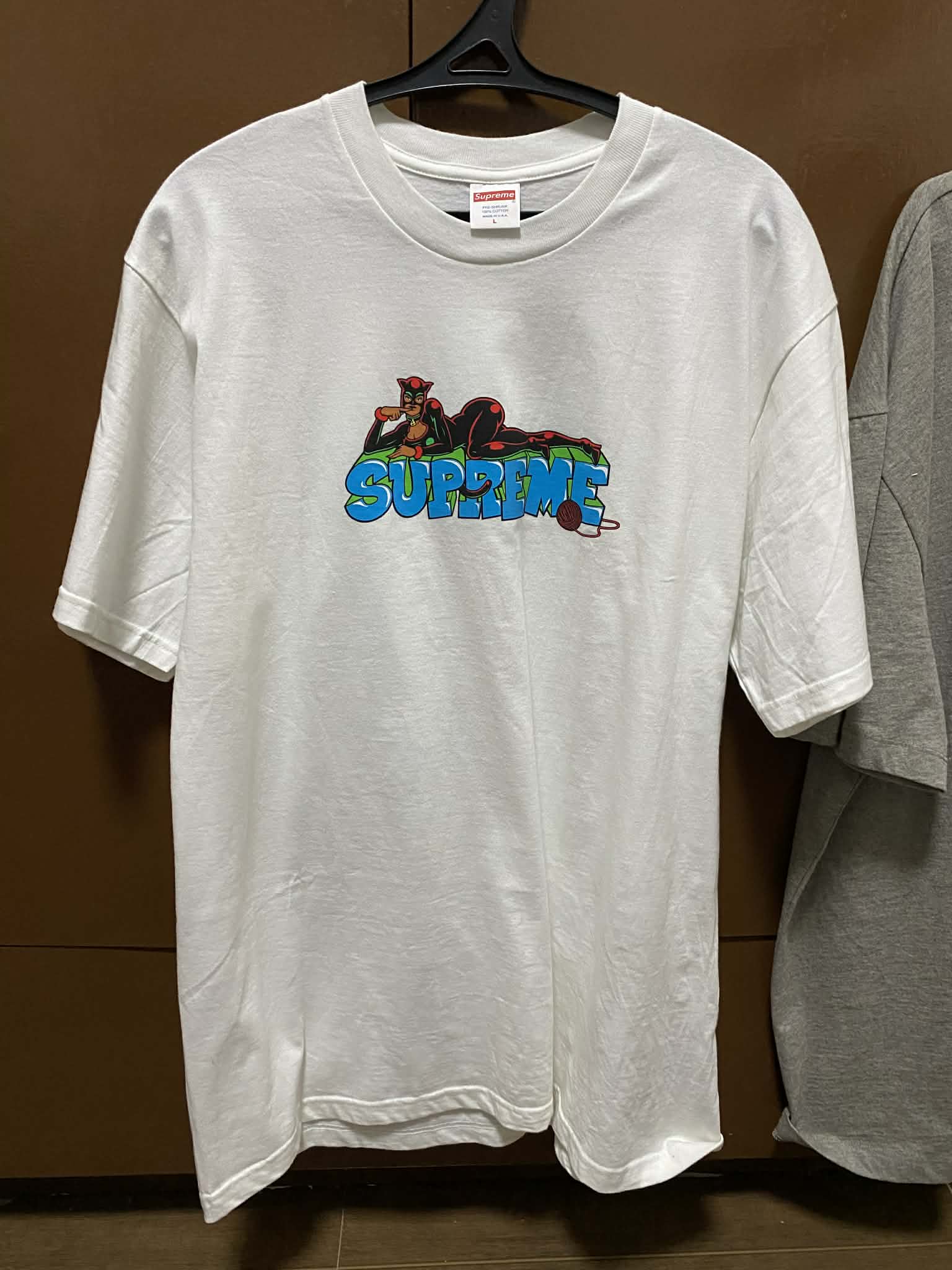 Travis Scott x Complexcon Vegas tee and Supreme Catwoman tee for 