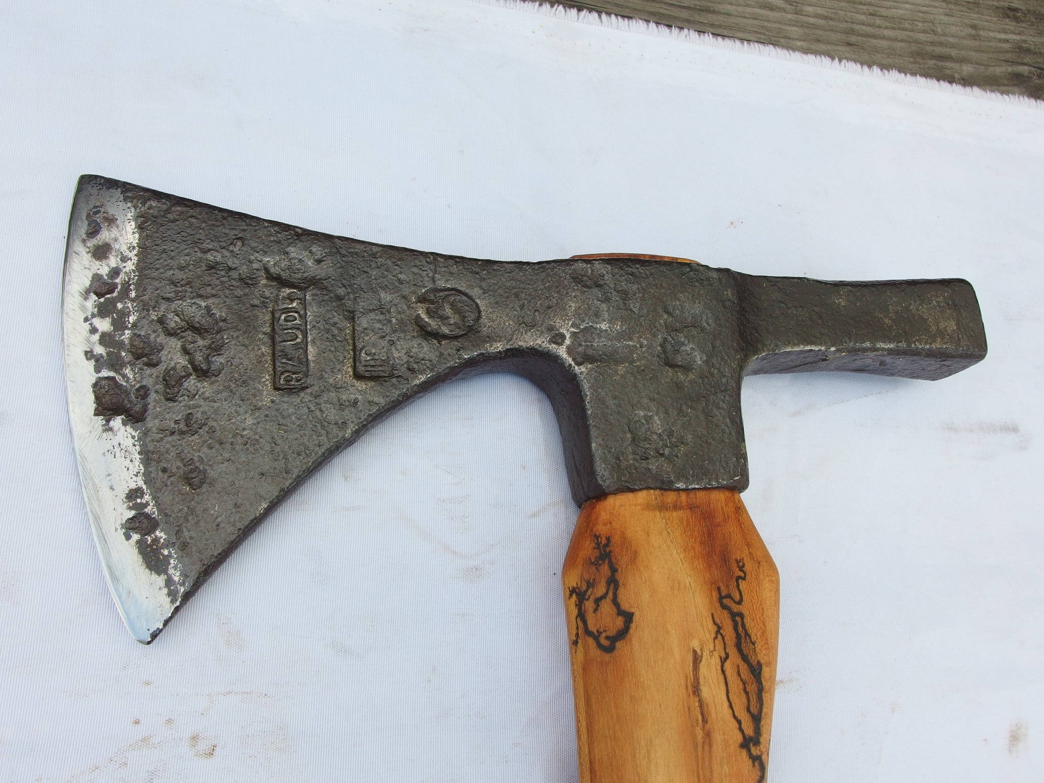What is the manufacturer of this 19th century French axe?