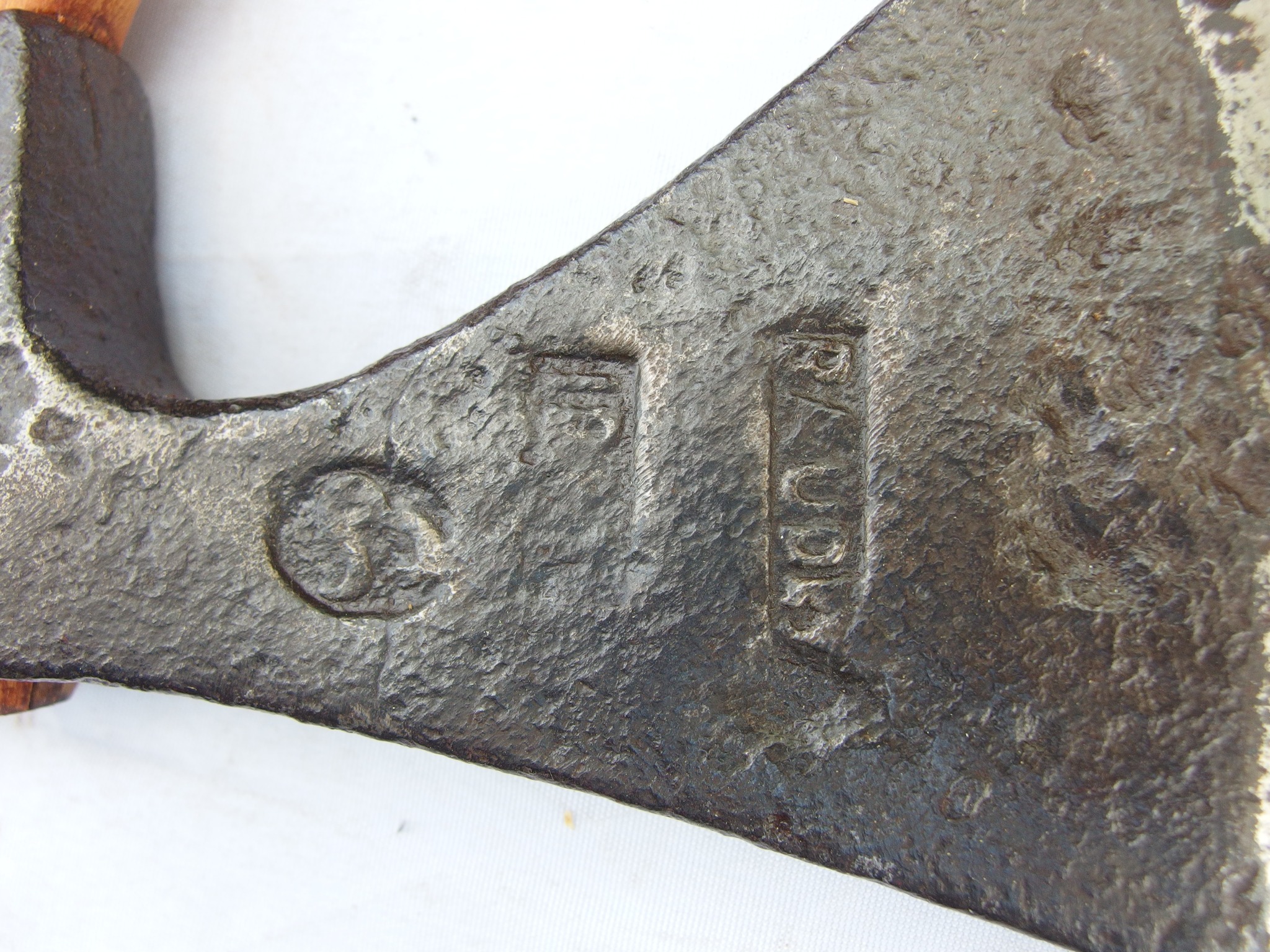 What is the manufacturer of this 19th century French axe?